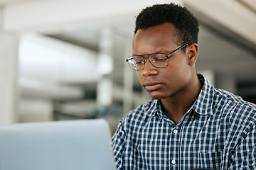 Image showing Thinking, black man and laptop for business, online reading and search internet in office. Young male, entrepreneur and computer for trading, concentration or focus for research, stress and workplace