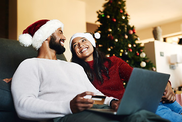 Image showing Christmas, couple and laptop on sofa, credit card or happiness together, ecommerce or festive season in lounge. Xmas, love or woman with man, payment, online banking or happy for transaction on couch