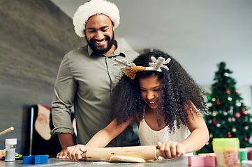 Image showing Christmas, cookie baking and family with happiness and bonding of a dad and girl at home. Happy, care and kitchen cooking together of a father learning kid to cook holiday food with love in a house