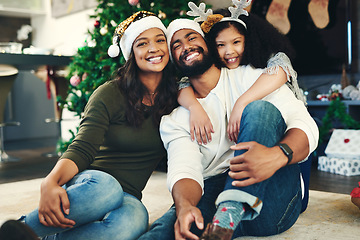 Image showing Portrait, Christmas and family celebration, happy or embrace together in living room. Xmas, love and mother with father, daughter and smile for holiday, hug or vacation for happiness, content or joy