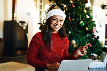 Image showing Portrait, Christmas and woman with laptop use credit card for transaction, cheerful or ecommerce for festive season. Xmas, young female and device for payment, online banking, happy with the internet