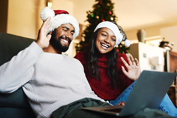 Image showing Video call, laptop and Christmas couple on sofa with hello wave for global, international or virtual communication with friends or family. Happy black people on zoom call for holiday celebration chat