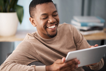 Image showing Black man, tablet and happiness of a person on a living room sofa with technology online. Social media content, video streaming or meme of a man smile on a house couch on wifi and web at home