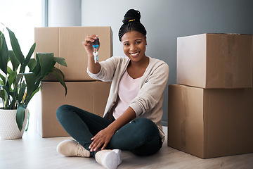 Image showing Boxes, black woman and homeowner with keys, to new home and happiness in home. Property, African American female and lady moving into house, happy and content with apartment, excited and portrait.