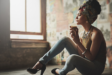 Image showing Coffee, relax and thinking black woman on the floor of a living room with fashion in her apartment. Idea, style and African girl content with tea drink, peace and calm in the lounge of her house