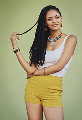 Image showing Fashion, beauty and portrait of black woman on green background in studio with creative, exotic and designer jewellery. Summer, African style and happy girl with braids, cosmetics and trendy clothing