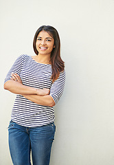 Image showing Fashion, portrait and woman with arms crossed on wall with mock up space. Happy, smile and fashionable, cool and confident comic female from Brazil smiling, cheerful and excited for life with mockup.