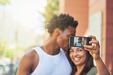 Image showing Phone, happy or black couple with selfie kiss for love, happiness or bonding in city, street or town. Photo, smile or man and woman with 5g smartphone for social media, media app or blog upload