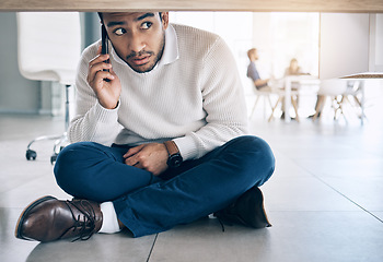 Image showing Phone call, office and businessman sitting on floor under table with worry, fear and scared expression on face. Depression, anxiety and stressed male worker on smartphone call for help and support