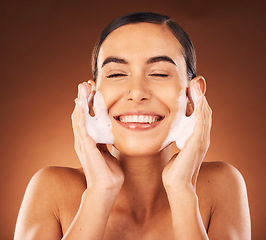 Image showing Face, foam and skincare woman in studio for cleaning, wash and cosmetics wellness with happy smile mockup. Young, glow and shine for skin care dermatology of beauty model with facial cleaner product