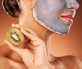 Image showing Facial, mask and hand with kiwi for skincare of woman for wellness, beauty and self care routine. Cosmetic, spa and pamper lifestyle girl with natural treatment on brown studio background zoom.