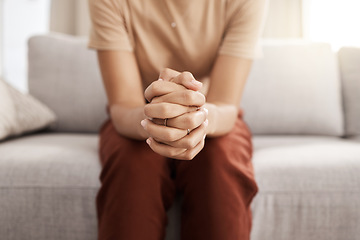 Image showing Stress, worry and hands of woman on sofa with mental health issue, problem and anxiety at home. Depression, sadness and close up of connected hand of girl with fear, nervous and stressed expression