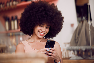 Image showing Black woman, afro or phone in coffee shop, cafe or restaurant on social media app, internet esports game or fashion blog. Smile, happy or relax student, trendy blogger or tourist on mobile technology