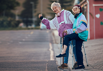 Image showing Hand, thumbs up and senior women with disability in a road for travel, fun and waiting for taxi in a city. Elderly, friends and disabled seniors hitchhiking while waiting for cab ride in a street