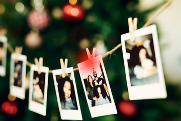 Image showing Christmas, family and photo hanging for decoration on peg line for festival, tradition and vacation at home. Photography, holiday celebration and canvas pictures of people to decorate Christmas tree