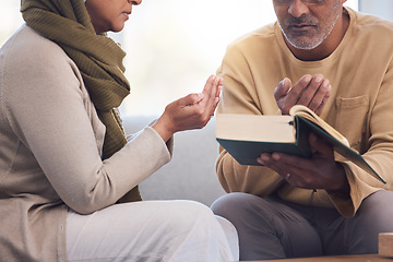 Image showing Worship, prayer and Muslim couple with a quran, reading and studying spiritual faith in their house. Religion, gratitude and holy and Islamic man and woman with a bible during Ramadan praying