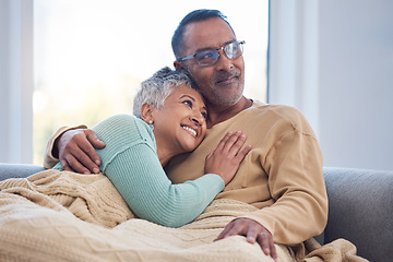 Image showing Senior couple, love and home sofa to relax, hug and care while thinking about future, life insurance and retirement together. Senior man and woman in lounge while in happy marriage with support