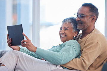 Image showing Movie, communication and senior couple with a tablet, streaming film and show on the living room sofa of their house. Website, social media and elderly man and woman with comedy and app on tech