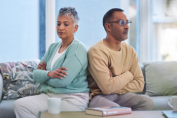 Image showing Senior couple, angry and frustrated after fight with stress in marriage and conflict in relationship with divorce. Mature man with woman on living room couch and anger with silent treatment at home.