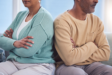 Image showing Mature couple, arms crossed or divorce fight on sofa in house or home living room in cheating affair, infidelity or mental health. Angry, annoyed or grumpy man and woman in marriage burnout or stress