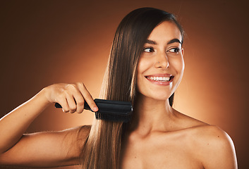 Image showing Hair care, happy and woman brushing hair, beauty smile and luxury salon against a brown studio background. Thinking, cosmetic shine and model with hair salon comb and hairdresser styling idea