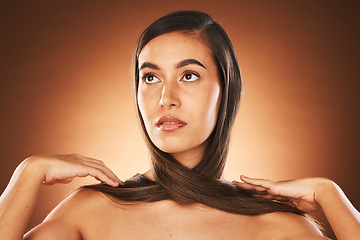 Image showing Hair care, beauty and woman in studio for wellness, health and natural hair treatment. Salon, luxury and model from Mexico with a keratin, brazilian or botox for healthy hairstyle by brown background