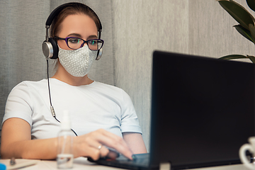 Image showing Woman in quarantine for coronavirus working from home