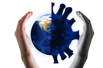 Image showing Earth and Covid-19 virus and hand.