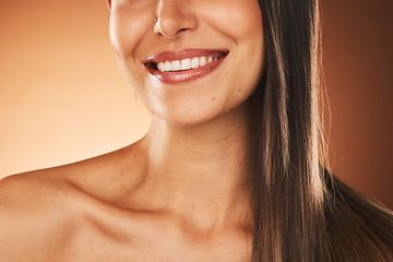 Image showing Happy, smile and woman with hair care, skincare and beauty cosmetic treatment in a studio. Happiness, health and girl model with a wellness facial skin routine isolated by a gradient brown background