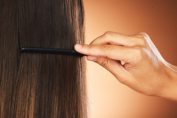 Image showing Hair care, back and hand with comb for beauty, growth and grooming in a studio background with mockup. Relaxed, texture and luxury hairdresser brushing a woman or clients healthy head at salon