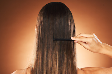 Image showing Beauty, hair care and comb for maintenace, combing and self care routine with growth, shine and repair shampoo on a gradient background. Back of female for health, wellness and hairstyle in studio