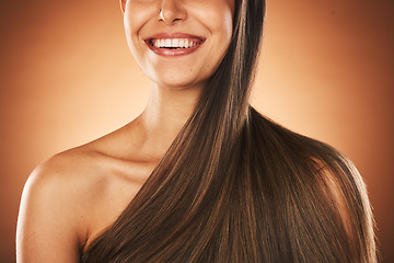 Image showing Beauty, hair and keratin with a model woman in studio on a brown background for natural treatment. Wellness, luxury and salon with a female posing to promote a haircare product or shampoo