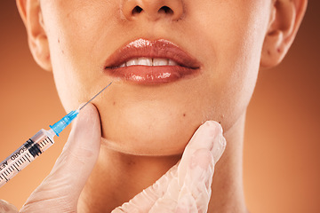 Image showing Beauty, lips and botox with a woman customer in studio on a brown background for plastic surgery. Doctor, trust and collagen with a female client getting an injection in her lip with a syringe