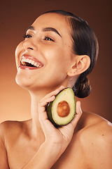 Image showing Beauty, woman skincare and healthy avocado eating for body wellness. health and nutrition. Happy model with skin glow from diet, vitamin a and fiber food smile about natural dermatology ingredient