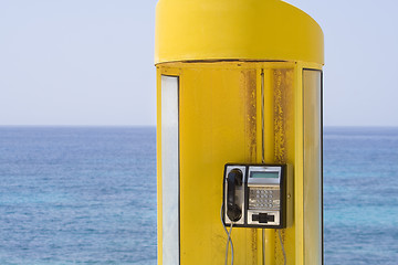 Image showing Yellow phone, blue sea