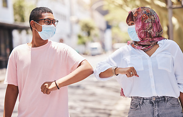 Image showing Covid handshake, elbow greeting and friends welcome of people with a mask outdoor. Couple together with social distance welcome for city outing and fun in summer with friendship or romantic love