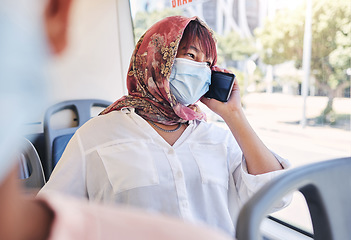 Image showing Muslim, phone and bus woman in covid face mask talking of travel safety, compliance and health information or networking Islamic, hijab international girl travel on city transport with cellphone call