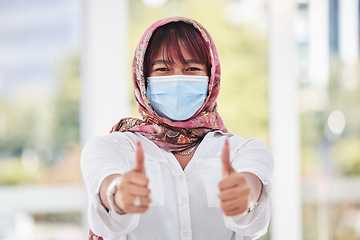 Image showing Business woman, covid and thumbs up for workplace compliance, corona virus health policy and muslim in face mask. Islamic employee portrait with ok, like and thank you sign for covid 19 safety goals