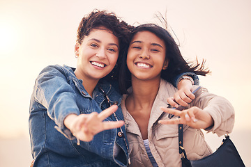 Image showing Lgbtq, couple and peace sign portrait of interracial lesbian women together on travel adventure. Summer, friends and smile of people in miami on vacation with happiness, hug and freedom lifestyle