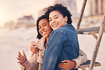 Image showing Couple, lgbtq hug and smile on beach together for relax interracial portrait on travel vacation or quality time. Diversity, lesbian women and happy for love, support and care on summer holiday