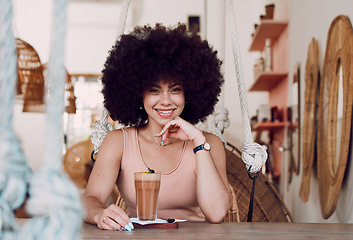 Image showing Black woman in coffee shop portrait with drink, relax with natural hair and smile, happy alone for self care date and pride with afro for self love. Happiness, African woman in cafe for coffee break.