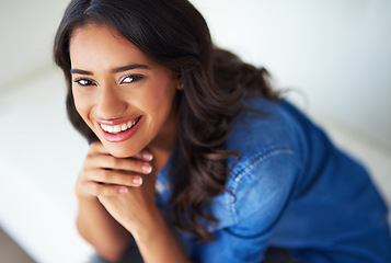 Image showing Portrait, face and happy with a black woman in her home to relax alone on the weekend from above. Smile, freedom and sofa with an attractive young female resting in her house living room