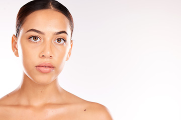 Image showing Skincare, beauty and portrait of Latin woman on a white background studio for dermatology, body care and heath. Wellness, spa and face of girl with facial treatment, skincare products and cosmetics