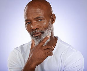 Image showing Portrait, face and thinking with a senior black man in studio on a purple background with an idea. Confidence, serious and mindset with an elderly male pensioner contemplating on a wall background