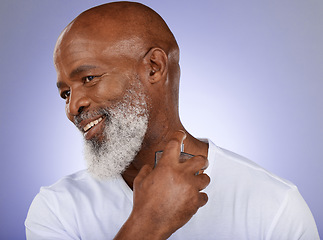 Image showing Man, perfume and cologne bottle on studio background for mature cosmetics, luxury wellness or body spray. Smile, happy and black model with parfum fragrance on purple mock up backdrop for clean smell