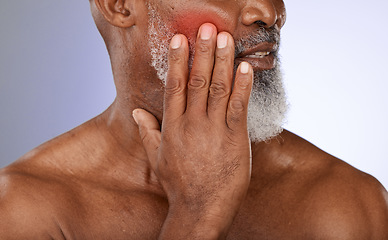 Image showing Senior man with cheek pain in studio with tooth ache, illness or dental problem in his mouth. Sick, painful and elderly guy in retirement with teeth cavity and sore face isolated by purple background