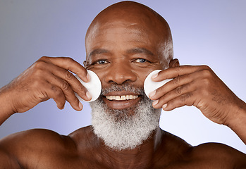 Image showing Skincare, facial cotton and senior black man on purple background in studio for beauty, wellness and cosmetics. Luxury spa, dermatology and face portrait of elderly male with pads to cleanse skin