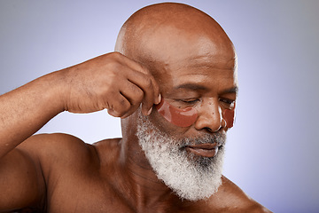 Image showing Senior man, eyes mask and face skincare wellness in studio for beauty, cosmetics dermatology or skin treatment. Facial care, natural eyecare product and body care cosmetology in purple background