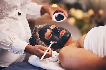 Image showing Senior woman, charcoal face mask and at spa to relax, clear and smooth skin. Luxury, mature female and black paste for organic facial detox, natural beauty and wellness for peace, calm and skincare.