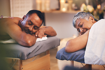 Image showing Massage, relax and spa with a senior couple lying on a bed in a health or wellness center for luxury treatment. Health, zen and hospitality with a mature man and woman customer in a salon for therapy